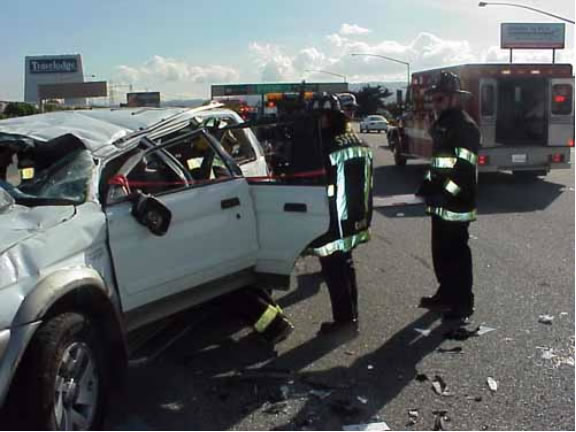 HAND TRUCK CAUSES ROLL OVER AUTO ACCIDENT